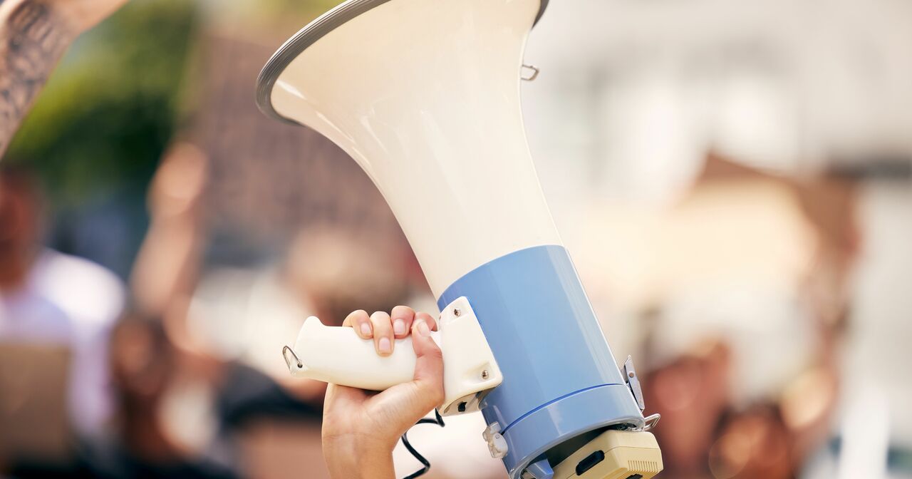 Protester holding a megaphone during a rally
