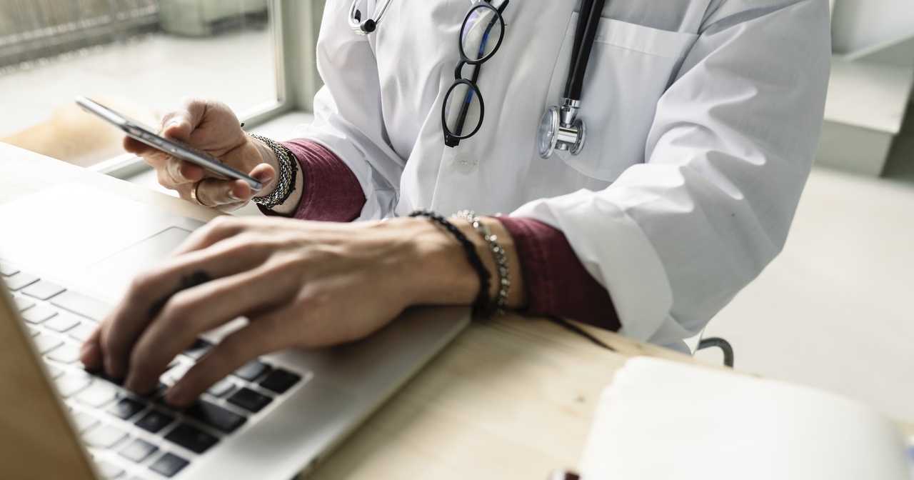 close-up of a female doctor using a laptop