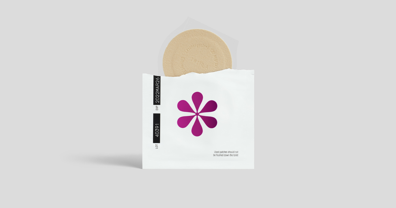 An open birth control patch packaging, with the patch peaking out the top